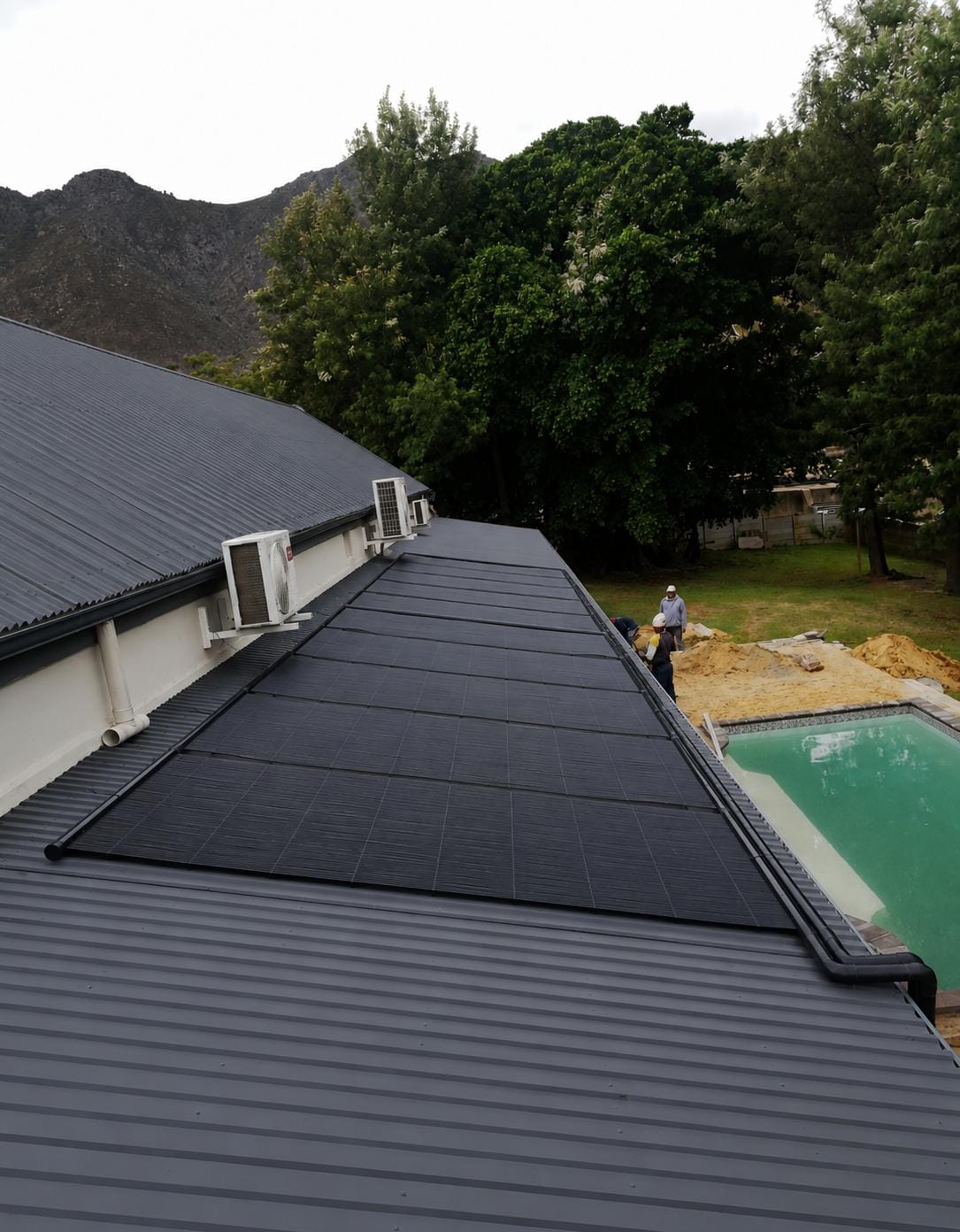 Solar pool heating panels installed on a residential roof
